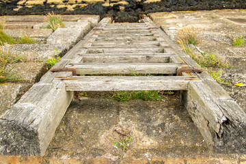 A Harbour Wall Ladder Giving Access To And From The Waters Below
