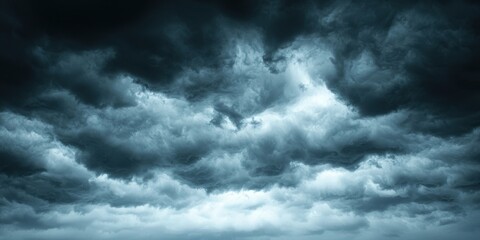 Obraz premium Dramatic stormy clouds looming over a dark sky, ominous and powerful.
