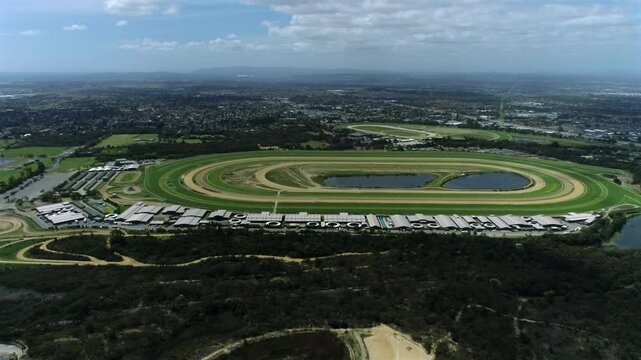 Amazing aerial fly towards thoroughbred racing track