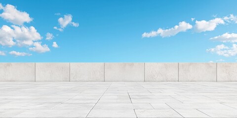 Fototapeta premium Empty rooftop with concrete wall against a clear blue sky.