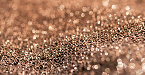 Bronze metallic background with partial blur. Fancy background.