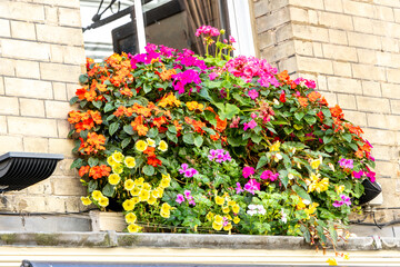 Beautiful Hanging Baskets On A Balcony For The Owners And Passers By To Enjoy