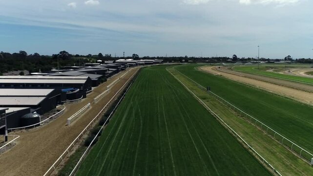 Flying down the straight of a horse racing track