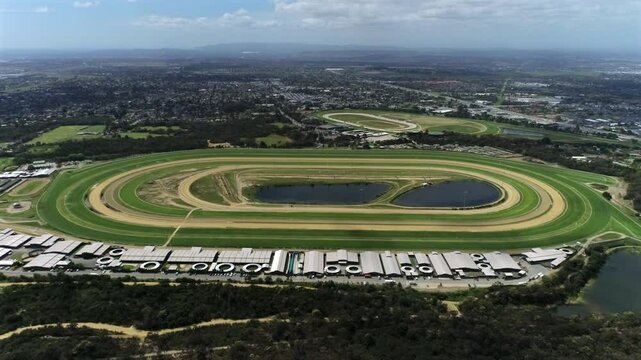 Drone reveal of stunning horse race track sunny