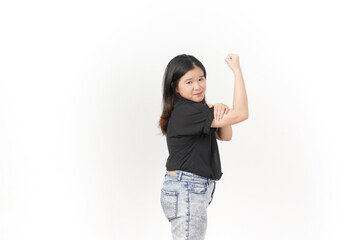 Obraz premium beautiful Asian woman strikes a bodybuilding pose, raising her arms confidently against a white background