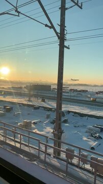 The plane comes to land on the runway in winter.