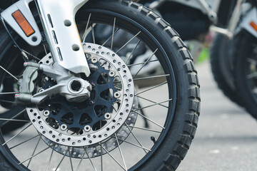 Motorcycle cruising down the road under the golden sunset, basking in the warm glow. A perfect moment to hit the open road with endless possibilities ahead. Space for your personalized message.