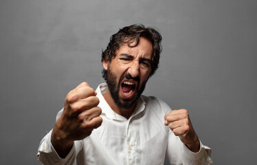 looking confident, angry, strong and aggressive, with fists ready to fight in boxing position
