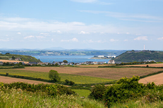 View of Cork Harbour from Templebreedy near Crosshaven, with green fields and the sea in the background, Ireland