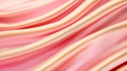 Soft pink and gold waves blending into blurred background create serene atmosphere