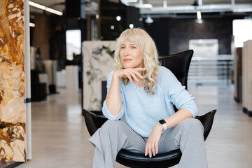 Confident Woman in Modern Office Setting Portrait