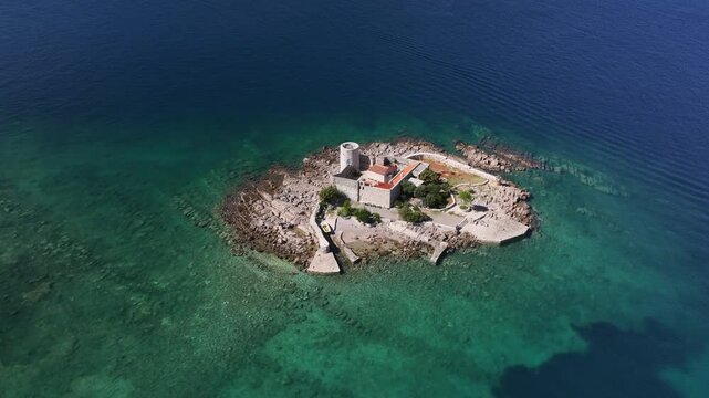 Aerial view of of Otocic Gospa island with an Orthodox church, Kotor Bay, Montenegro
