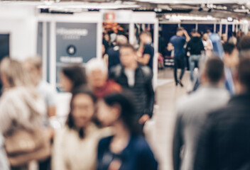 Abstract blurred people at exhibition hall of expo event trade show. Business convention show or job fair. Business concept background