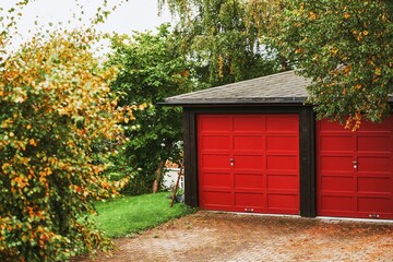 Modern house with wooden garages in suburban setting