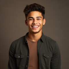 Fototapeta premium Headshot of a young man in a casual shirt with a calm expression on a solid color background