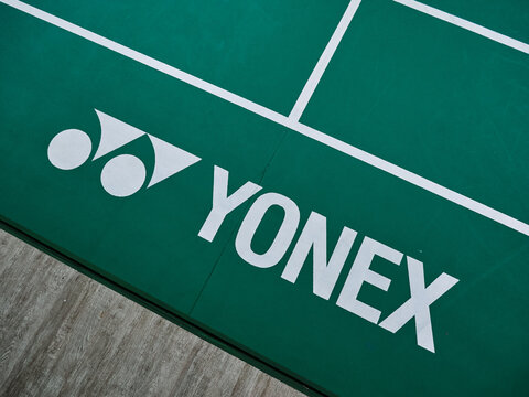 Yonex logo embedded on top of badminton court mat. BWF badminton standard court 