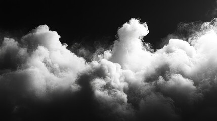 Obraz premium The fluffy white clouds floating on a dark black background create a sharp contrast, highlighting the softness and texture of the clouds. This image conveys a sense of tranquility and isolation