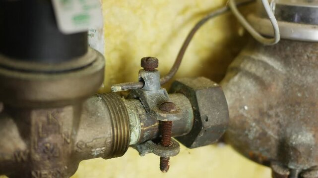Camera pans over water supply line going into house
