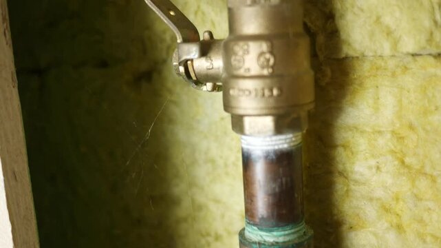 Camera pans over water supply line and shutoff valve