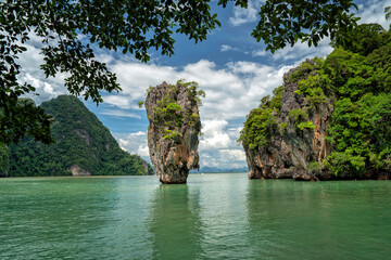 Naklejka premium James Bond Island in a beautiful bay in Thailand. Cruises to the islands and beaches of the Andaman Sea. Krabi National Park, Thailand
