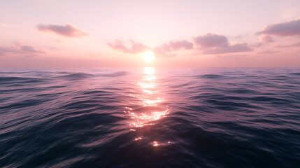 Obraz premium Beautiful sunset over calm ocean waves with a stunning pink and purple sky reflecting light on the serene water surface creating a peaceful atmosphere