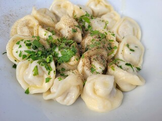 Portion of pelmeni, traditional dinner.