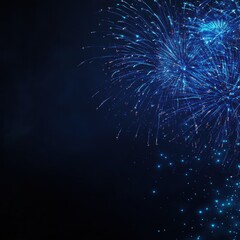 Fototapeta premium Colorful blue fireworks display against a dark background, showcasing festive sparks and vibrant light patterns.