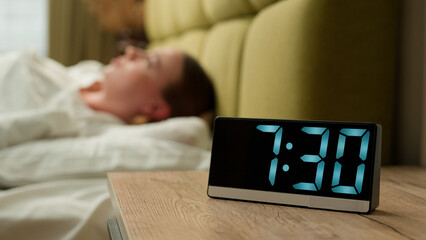 Annoyed irritated girl wake up in early morning bed home bedroom stressed dissatisfied insomnia health problem sleep disorder woman female lady anger furious loud sound ringing of alarm clock beat off