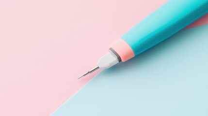 Fototapeta premium Close-up view of a turquoise pen resting on a pastel background, ideal for creativity and design.