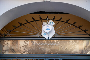 A ribbon with blue letters announces the birth of a baby boy in a house in Italy