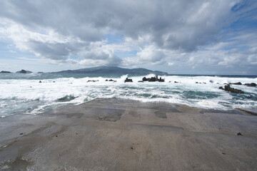 high waves on a beach on pico island