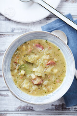 Cabbage soup on wooden background. Top view.