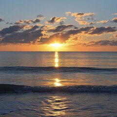 Fototapeta premium A mesmerizing sunset casting vibrant orange hues over a tranquil ocean, embodying serenity and peace.