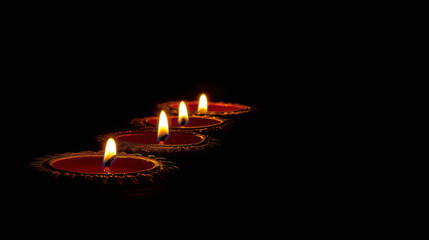Fototapeta premium Happy Diwali celebration with Diya lit candle design isolated on black background