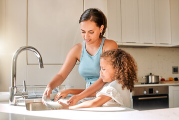 Mother, kid or washing dishes in kitchen for help, learning or responsibility development in home....