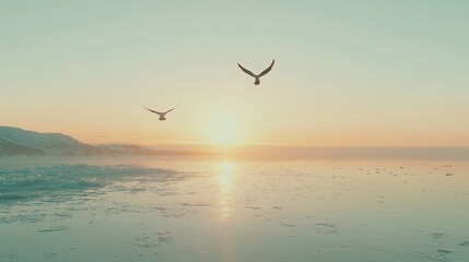 Two Birds Flying Over a Frozen Sea at Sunset.