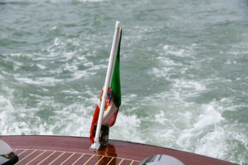 Italian flag on water taxi in Venice