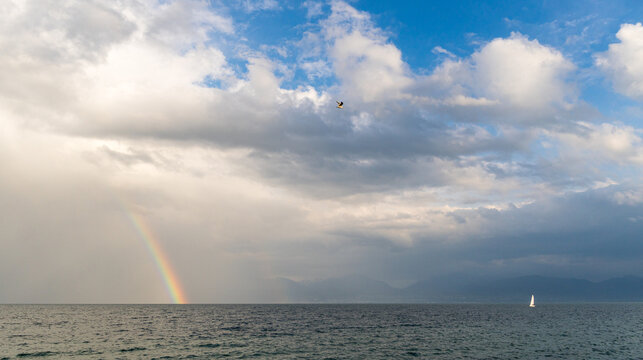 Rainbow and sailboat on Lake Geneva, Switzerland