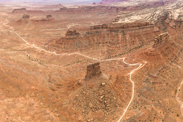 Aerial view of a winding desert road in the Utah desert