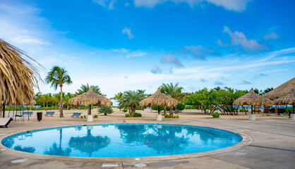swimming pool with sun loungers