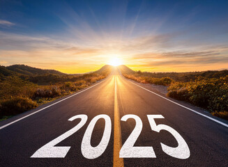 New year 2025. Text 2025 written on the road in the middle of asphalt road at sunset.