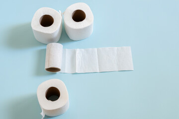 Top view of toilet paper roll on blue background