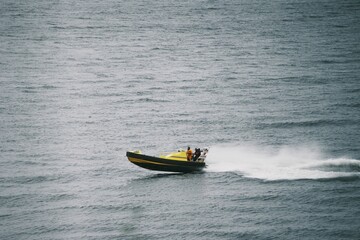Rescue operation in progress by Coast Guard boat