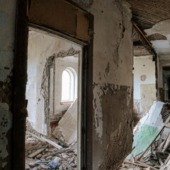 Interior of an abandoned, crumbling brick building in Krasnofarforny, Leningrad region, Russia,...