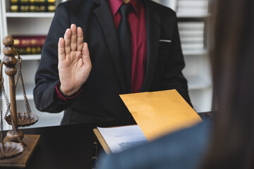 Honest officer or lawyer refuses to take bribes from criminals. Businessman refusing to accept...