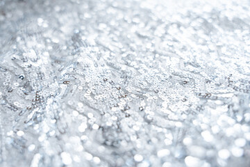 Close-Up of Sparkling Silver Sequin Fabric with Abstract Geometric Pattern.