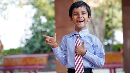 Cheerful Happy smiling village school kids in uniform standing. Concept of friendship, education and togetherness