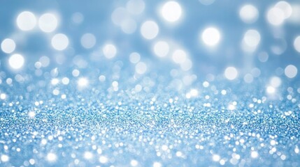 Fototapeta premium Shimmering light blue bokeh with sparkling glitter, perfect for Christmas or New Year themed backgrounds