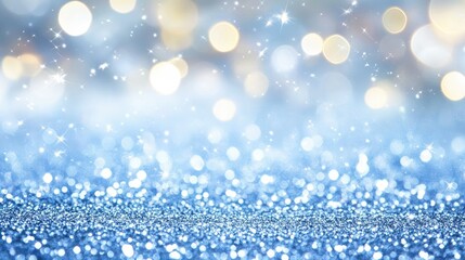 Fototapeta premium Soft blue bokeh background with shimmering glitter, ideal for Christmas or festive New Year designs and greetings