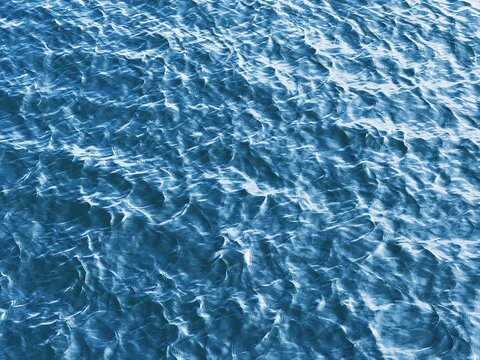 Blue rippled water aqua background.